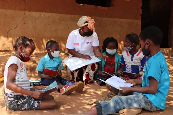 Teacher working with children in Mozambique